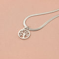 Stainless steel tree pendant necklace on a textured snake bone chain, shown in gold colour.