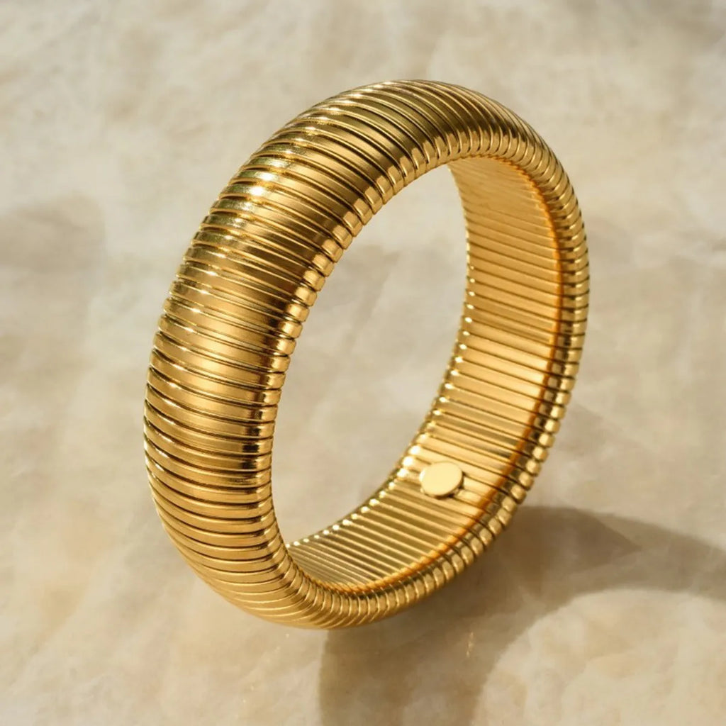 Women's elastic titanium steel bracelet with vertical stripe ring pattern in gold electroplated finish