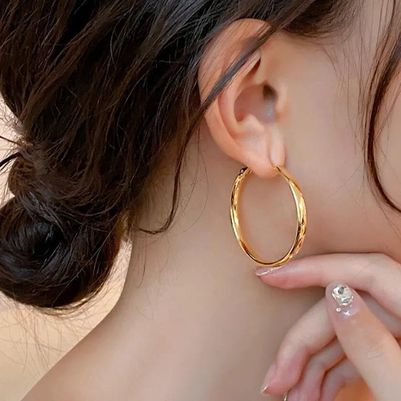 40mm diameter metal circle earrings in electroplated copper with gold and silver colour options