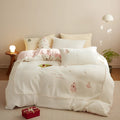 Winter milk fibre bedding set with green Christmas tree pattern showing quilt cover, sheet and pillowcases