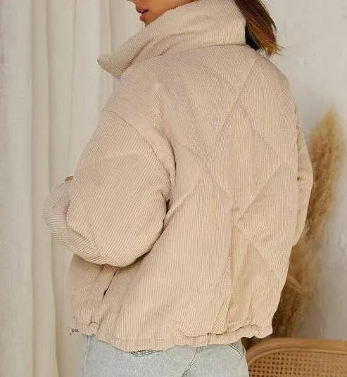 Apricot women's corduroy jacket with stand collar, long sleeves, and front zipper.