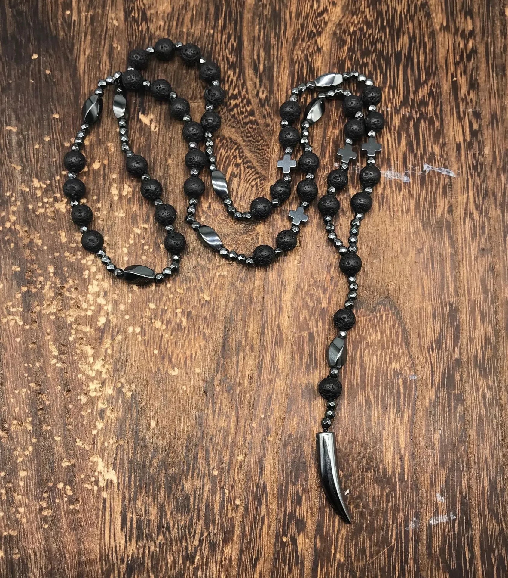 Men's stone cross pendant necklace on a ball bead chain with a safety lock clasp.