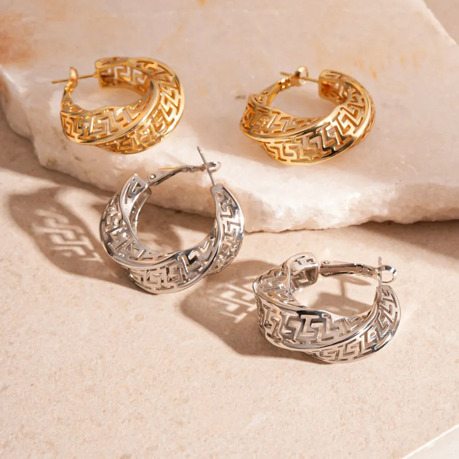 Women's geometric hollow stud earrings with twisted round design in gold and silver colour options
