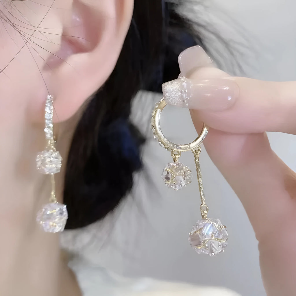 Silver confession balloon drop earrings with rhinestone ball and tassel pendant details and clip fastening