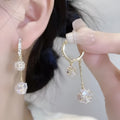 Silver confession balloon drop earrings with rhinestone ball and tassel pendant details and clip fastening