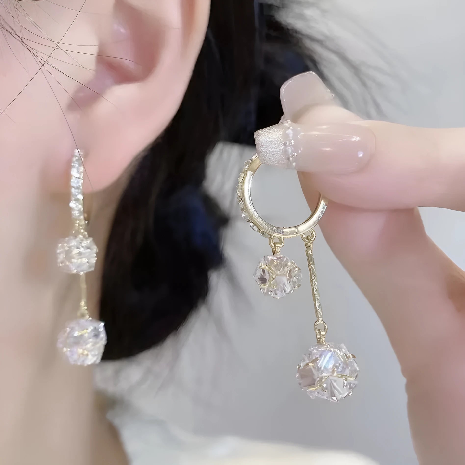 Silver confession balloon drop earrings with rhinestone ball and tassel pendant details and clip fastening