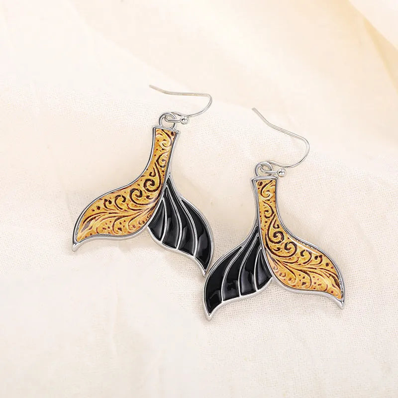 Women's fishtail earrings with retro whale design in white gold colour alloy metal