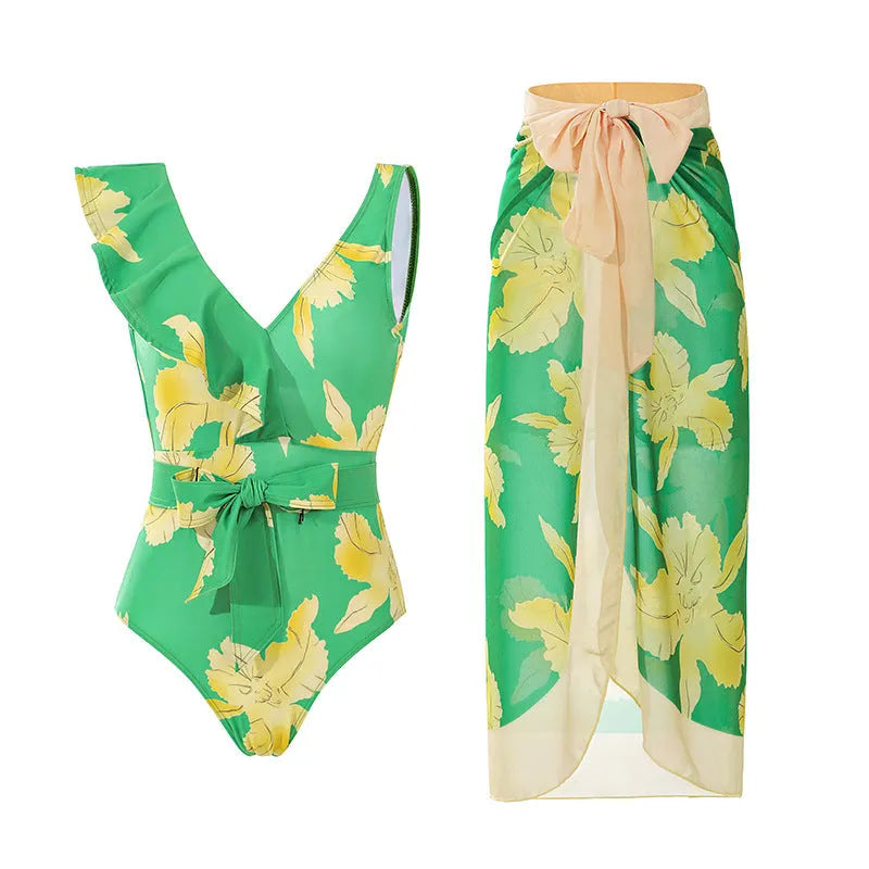 Women's solid colour one-piece swimsuit with spaghetti straps and a removable matching skirt.