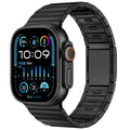Stainless steel Apple Watch strap with magnetic buckle in multiple colour options on a wrist.