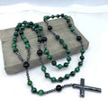 Men's stone cross pendant necklace on a ball bead chain with a safety lock clasp.