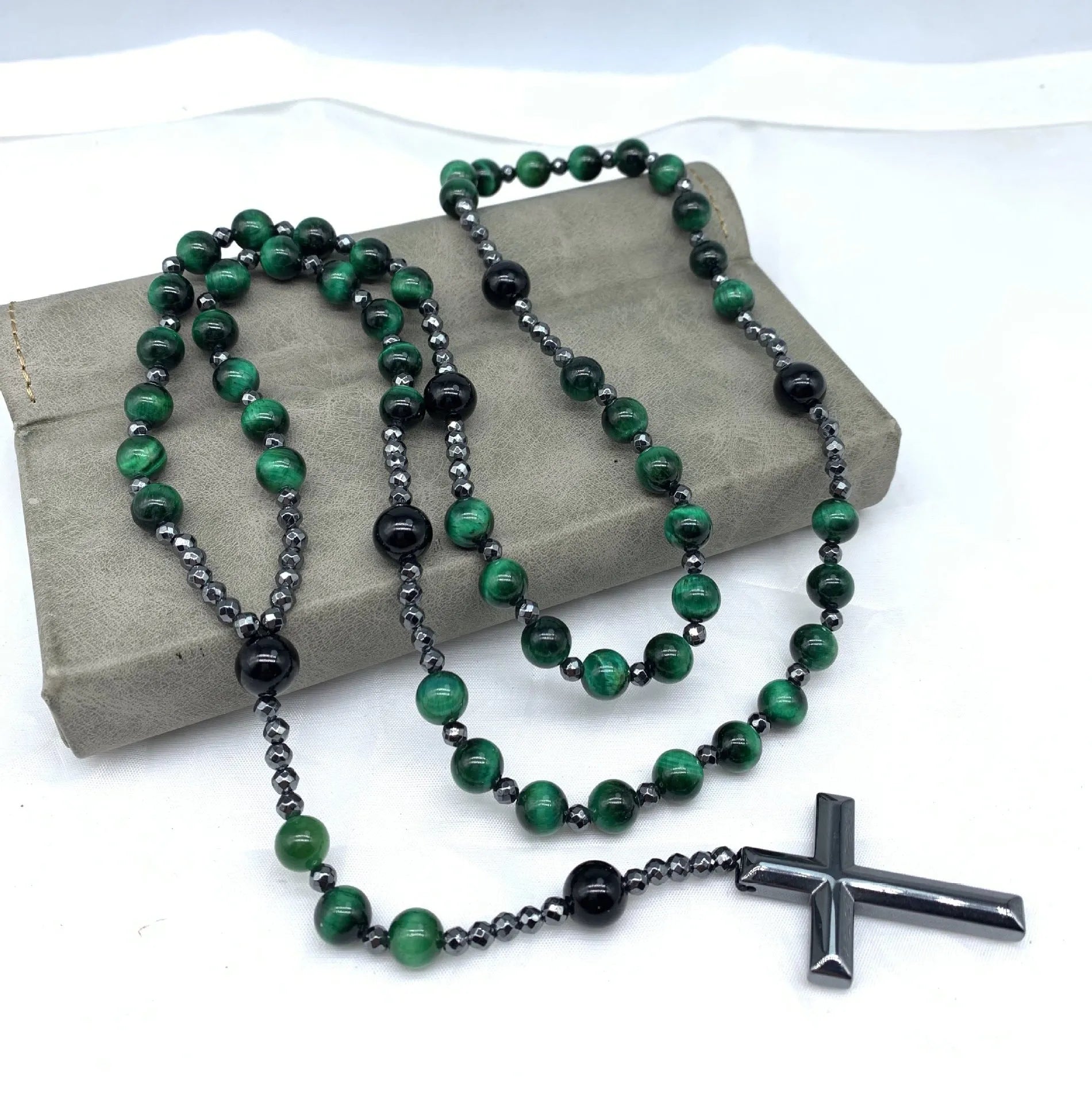 Men's stone cross pendant necklace on a ball bead chain with a safety lock clasp.