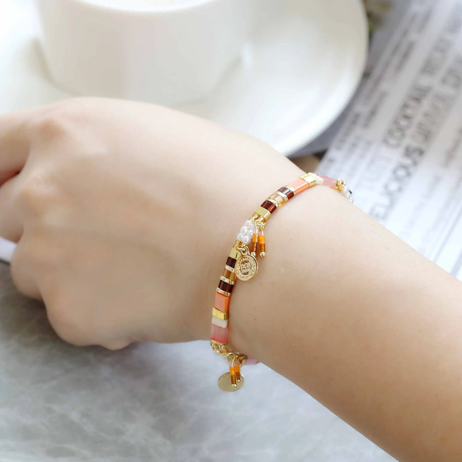 Women's imitation pearl beaded bracelet with glass coloured beads in six pearl lifting colour options