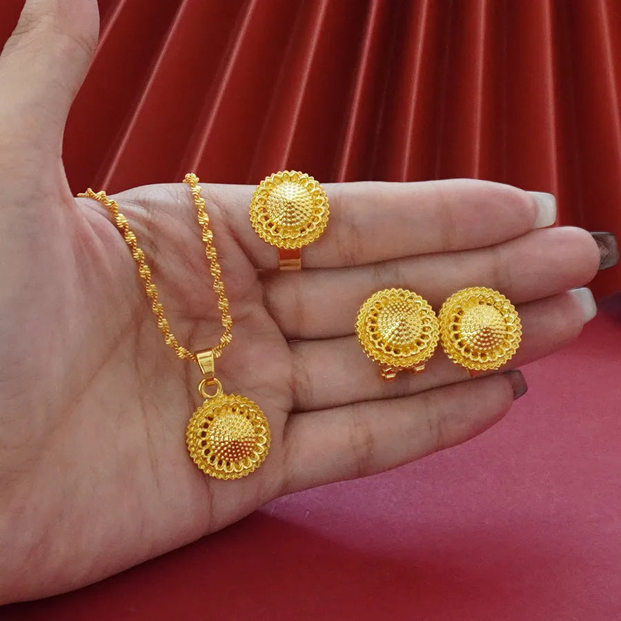 Three-piece gold electroplated jewellery set showing necklace with pendant, earrings, and matching ring