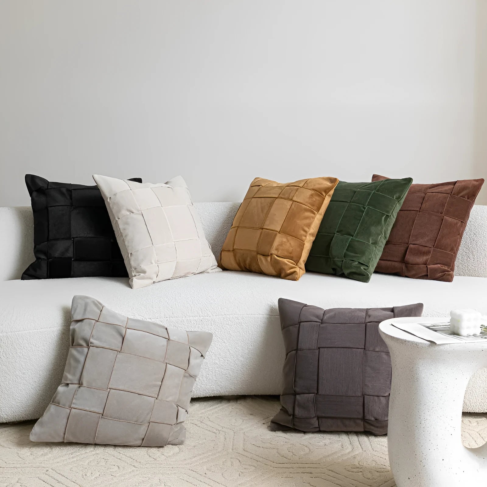 Chenille woven square pillow cushion in beige colour on a sofa