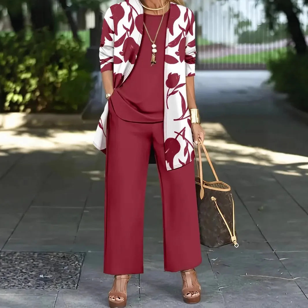 Women's blue three-piece casual suit featuring a long-sleeve coat, a vest, and full-length trousers.