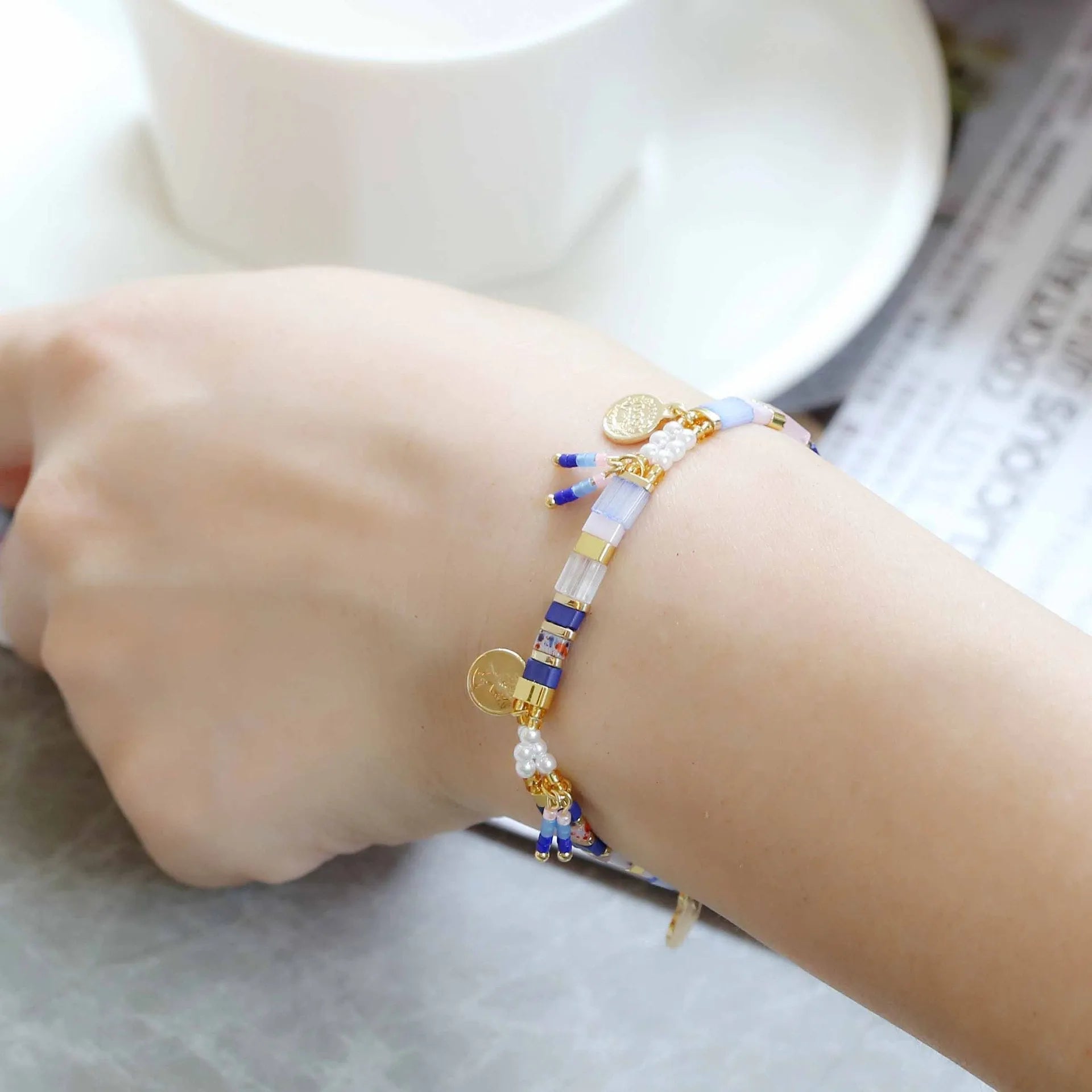 Women's imitation pearl beaded bracelet with glass coloured beads in six pearl lifting colour options