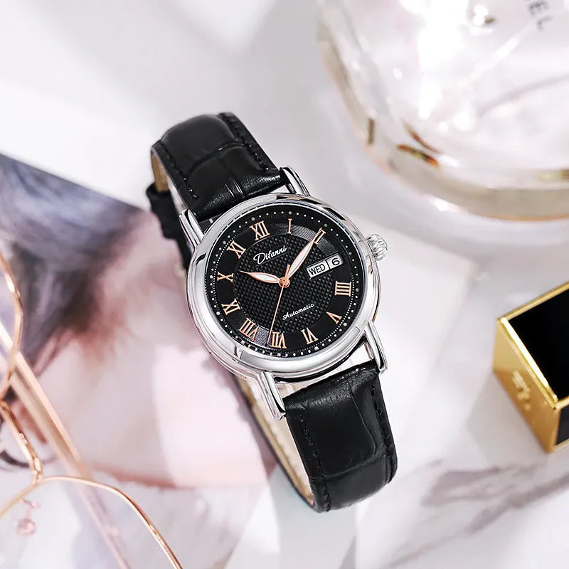 Women's automatic mechanical watch on wrist showing open case back with visible movement
