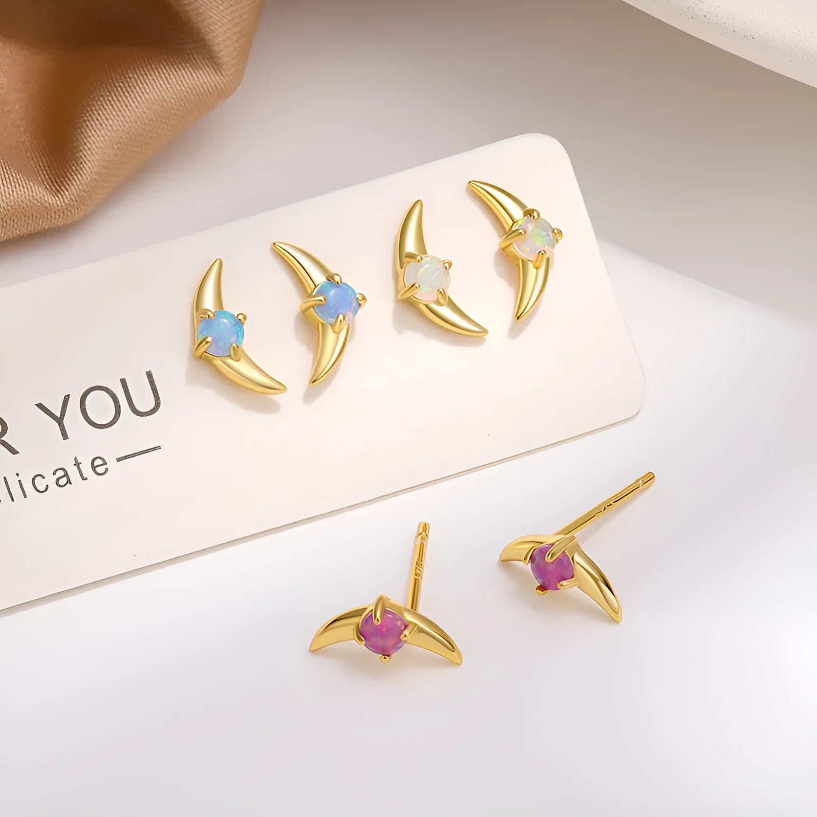 Geometric 925 silver women's earrings with gold or platinum electroplated finish and blue, purple, or white cubic zirconia stones.