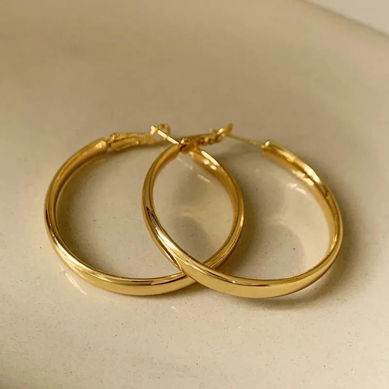 40mm diameter metal circle earrings in electroplated copper with gold and silver colour options