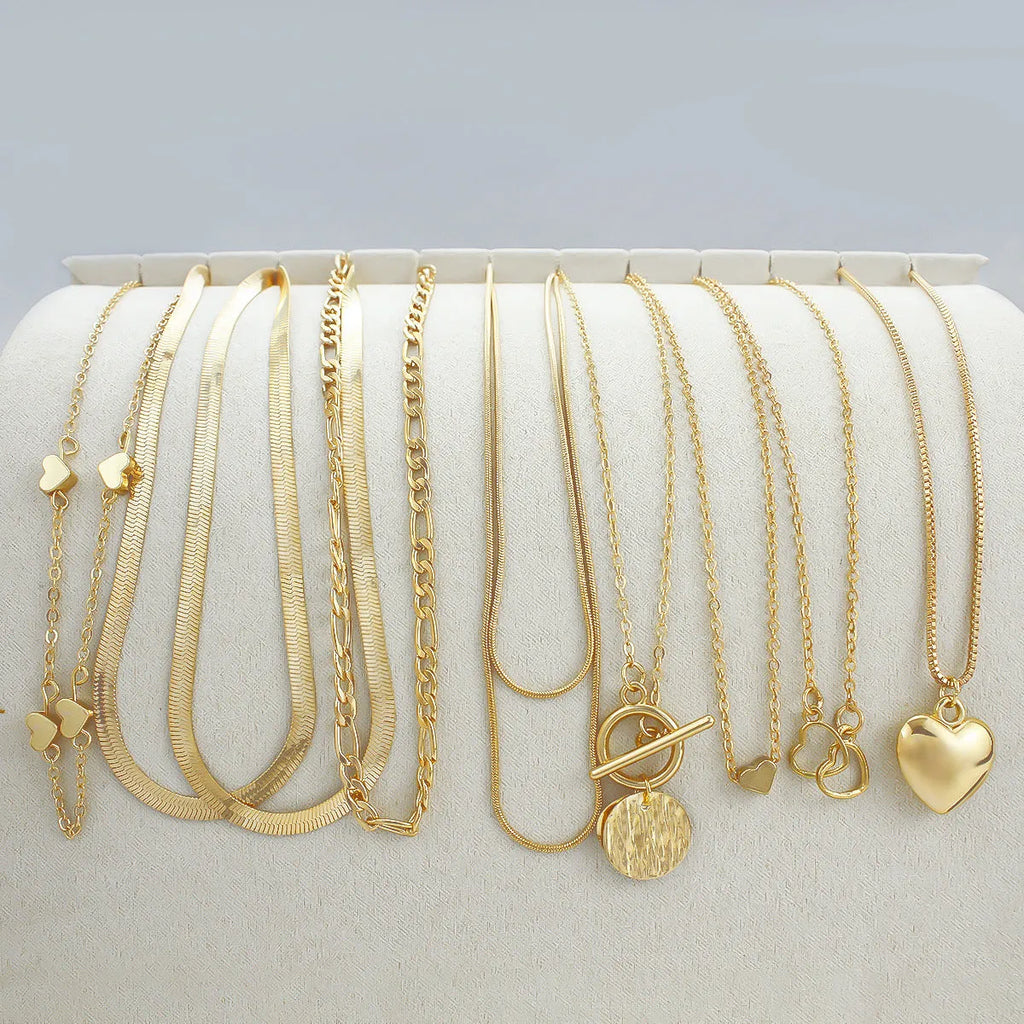 10-piece gold electroplated women's necklace set with snake bone chains and simple alloy pendants