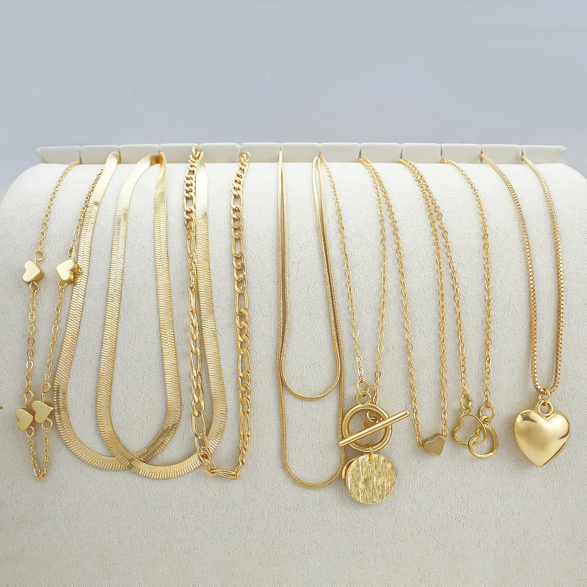 10-piece gold electroplated women's necklace set with snake bone chains and simple alloy pendants