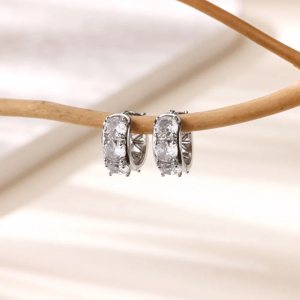Women's silver-tone U-shaped clip earrings with inlaid clear zircon stones on the front.
