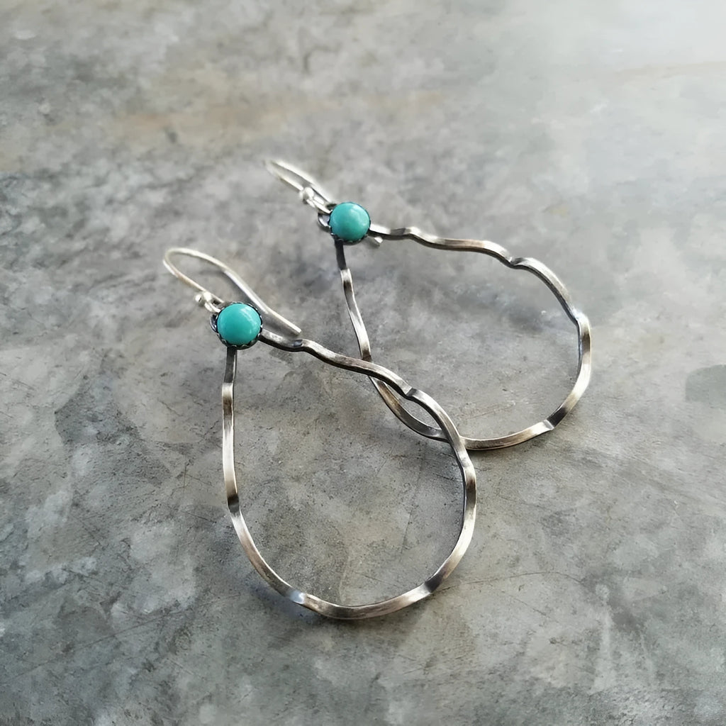 Circular geometric earrings with turquoise centre and antique silver finish