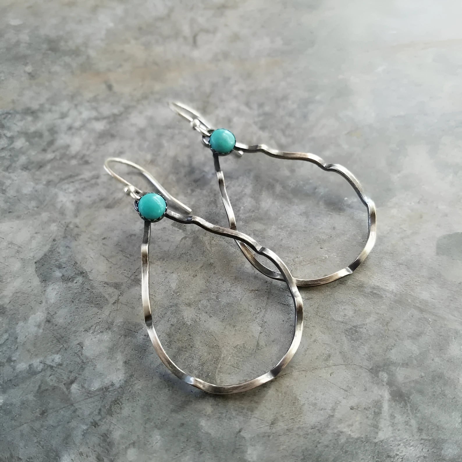 Circular geometric earrings with turquoise centre and antique silver finish