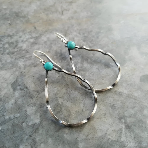 Circular geometric earrings with turquoise centre and antique silver finish