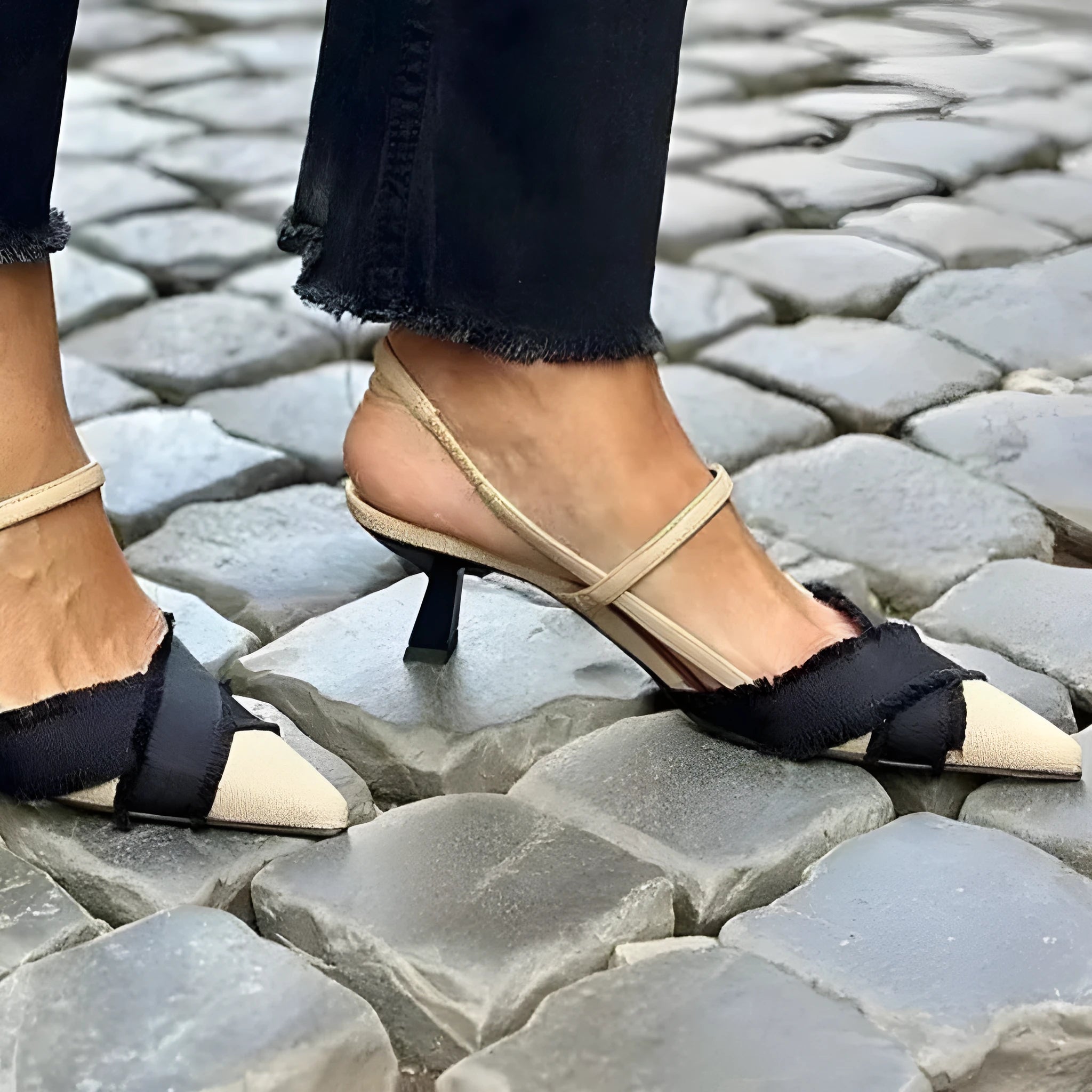 Women's apricot and black colour block stiletto sandals with pointed toe and buckle fastening.