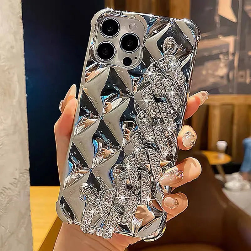 Gold diamond bracelet attached by chain to a TPU phone case for iPhone.