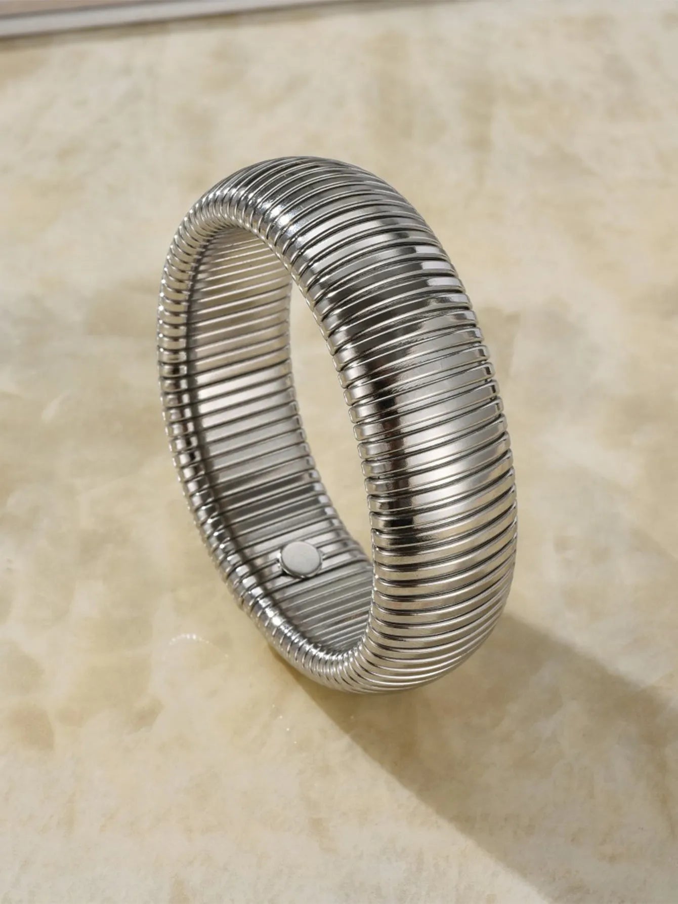 Women's elastic titanium steel bracelet with vertical stripe ring pattern in gold electroplated finish