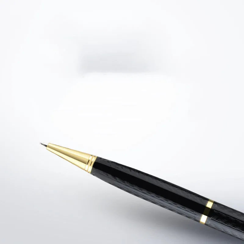 Black pen shaped audio recorder with zinc alloy shell shown next to included headset and USB data cable.