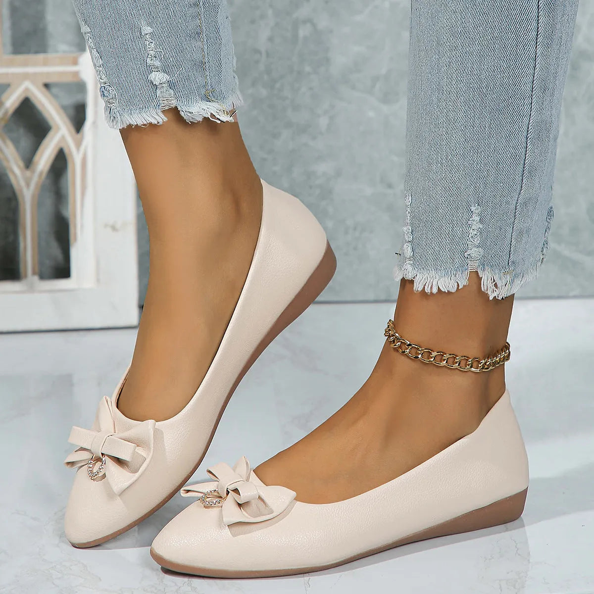 Women's beige flat casual shoes with a bowknot and shallow mouth design on a rubber sole
