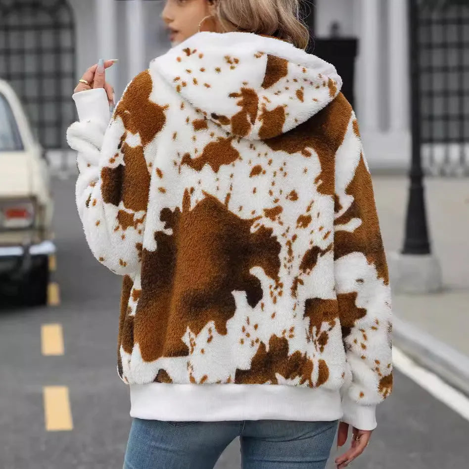 A man's yellow and brown cow print hooded cardigan jacket with a front zipper.