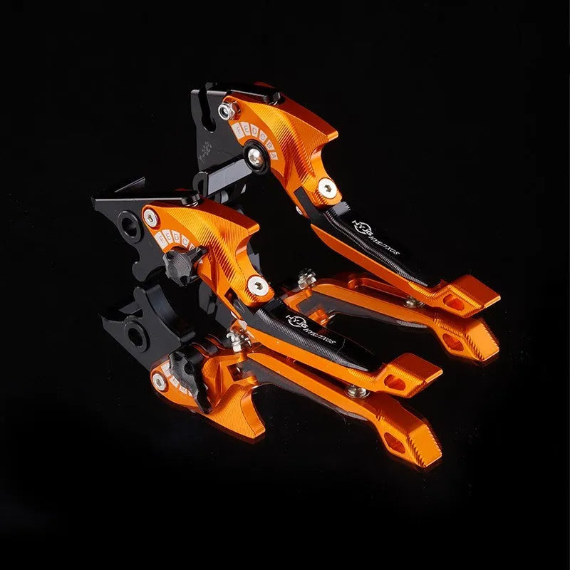 Pair of anodised metal motorcycle brake and clutch levers with adjustable length mechanism