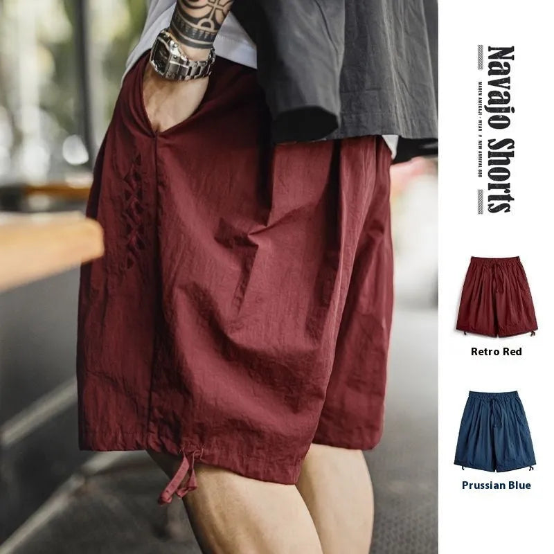 Men's loose fit Prussian Blue nylon shorts with embroidered design on leg, summer beach casual wear