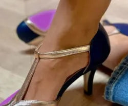 Women's round toe high heel in light blue pink with button fastening, shown in large size.
