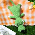 Plush dog toy with corn kernel texture in green grey or yellow featuring a built-in sound device for teeth grinding