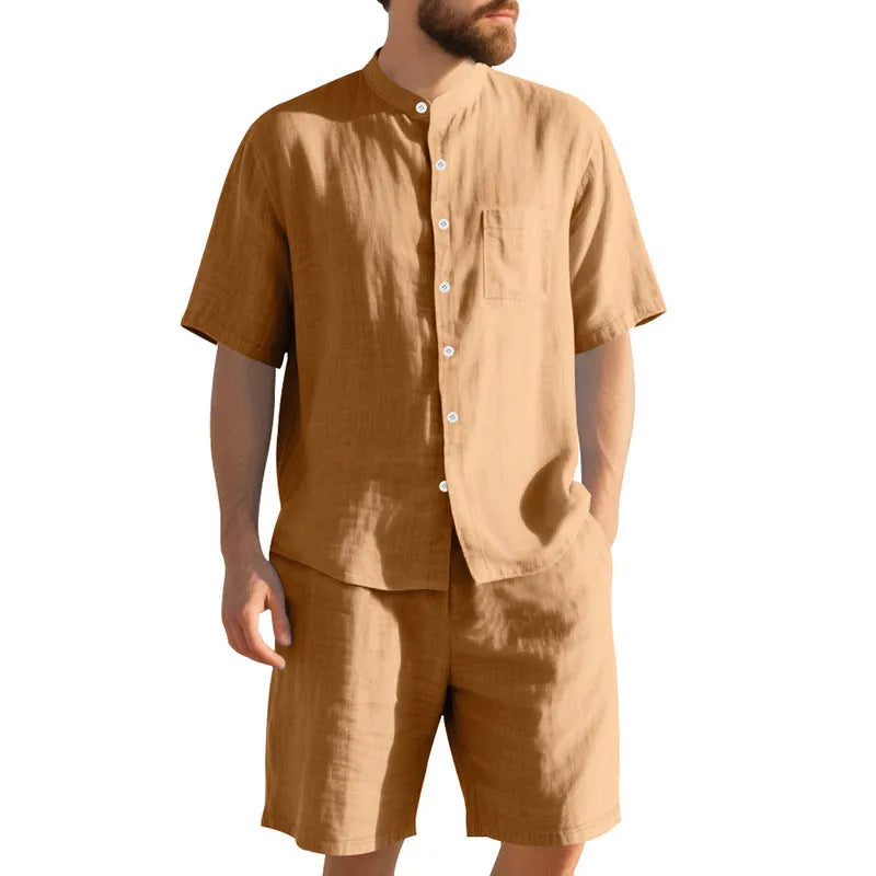 Man wearing a light blue linen blend short sleeve shirt and matching shorts, a casual summer two-piece suit.