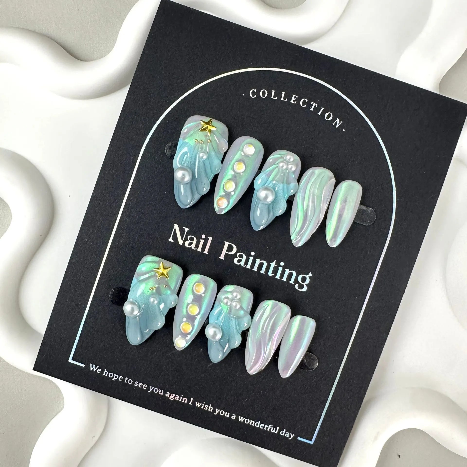 Hailang blue shell design artificial nail tips showing texture and four size options