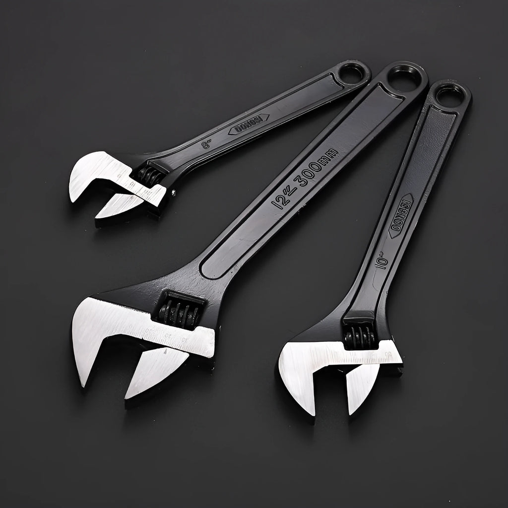 Stainless steel adjustable open-end wrench with blackened finish showing adjustment mechanism and four size options