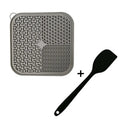 Blue silicone dog licking mat with textured pattern and suction cups on back