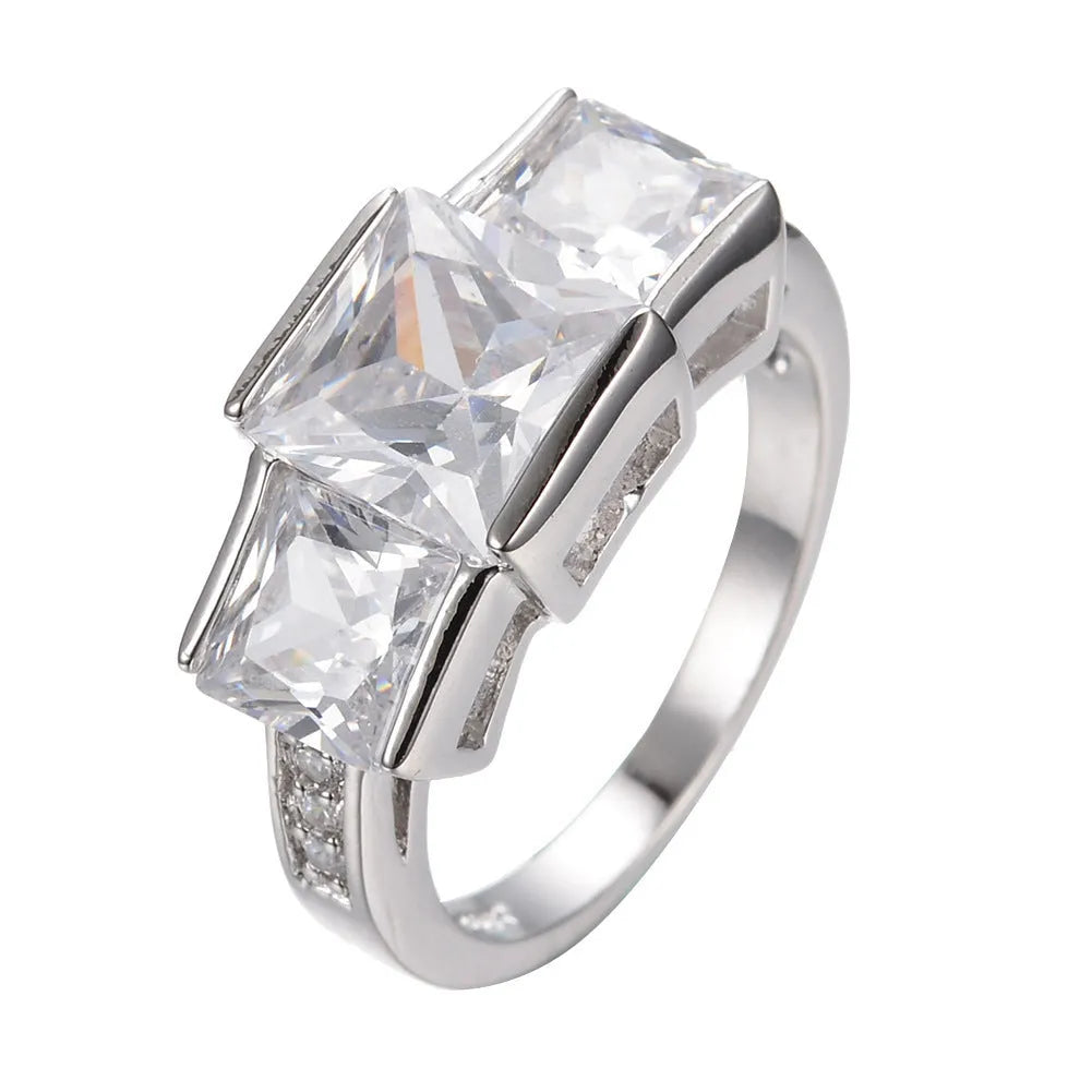 Women's geometric rainbow metal ring in electroplated copper showing colour options.