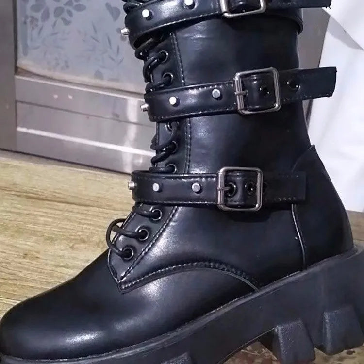 Black women's mid-calf boots with metal buckle detail and a side zip fastening.