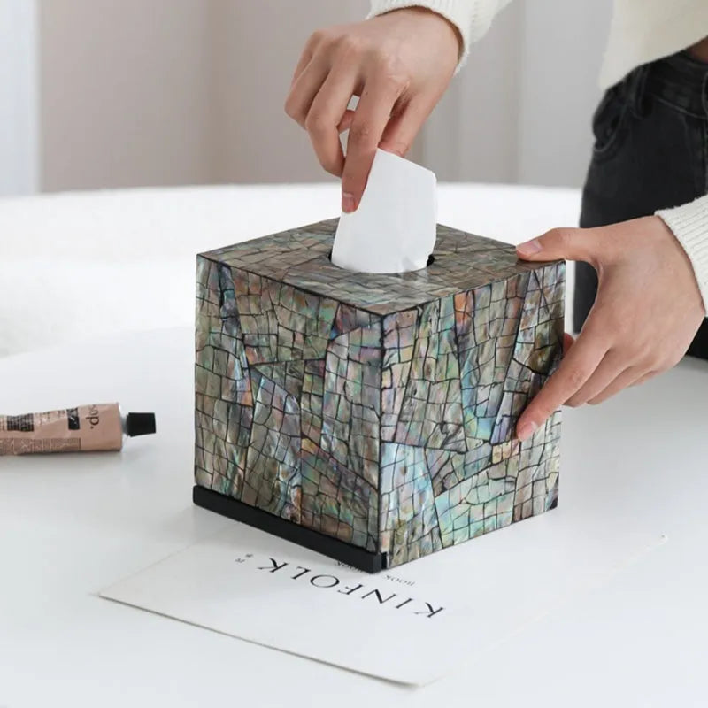 Natural shell rectangular and square storage box for tissue box organisation on a coffee table.