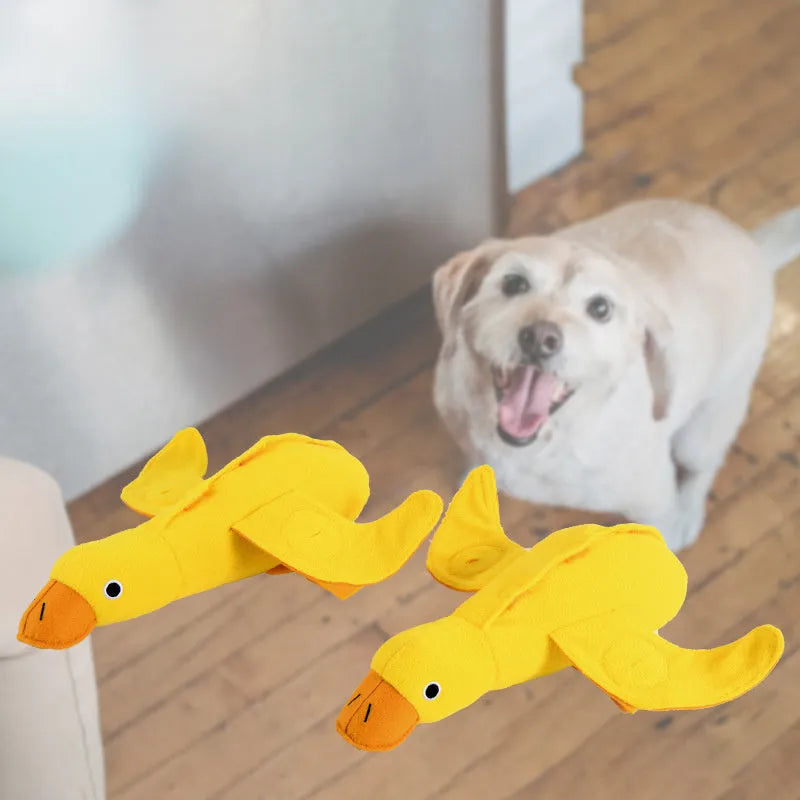 Yellow plush duck dog toy with treat holes and sound module for training and chewing