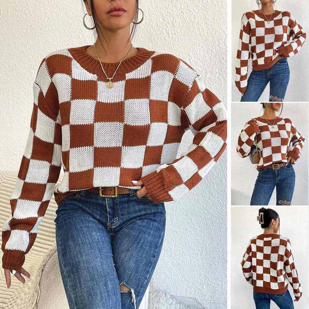 Dark brown plaid loose round neck acrylic pullover sweater on a hanger