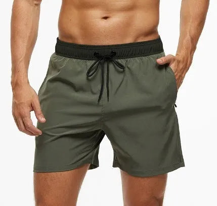 Men's blue training shorts with stitching waist detail and headband pocket for running and fitness