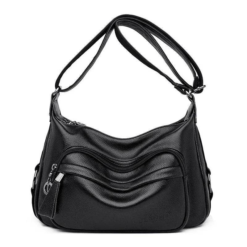 Blue horizontal square women's shoulder bag with soft PU construction and visible sewing thread detailing